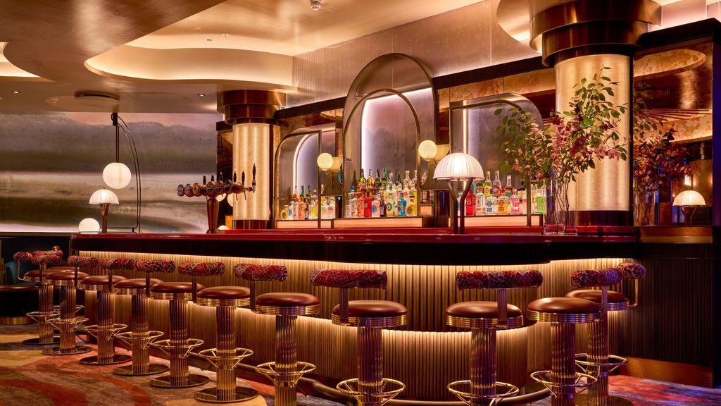 1878 at 3Arena: curved bar with fluted timber front and stools