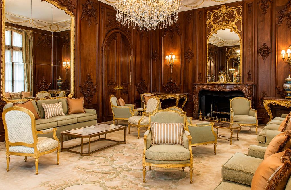 Belgrave Square drawing room with walnut panelling and gilded mirror