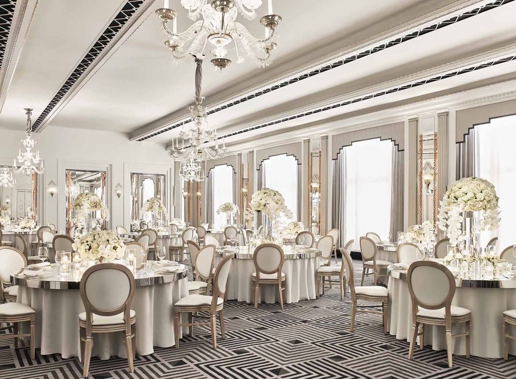 Claridge's Ballroom dressed for a white-floral banquet beneath Art Deco chandeliers