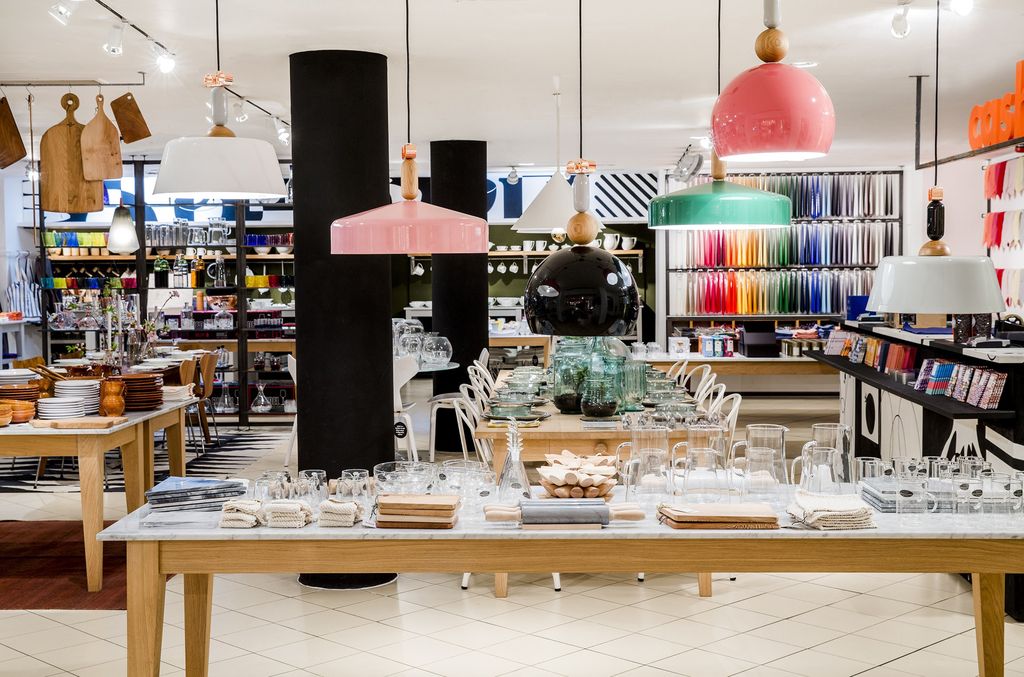 The Conran Shop, Sloane Square: colourful pendant lamps over a glassware table
