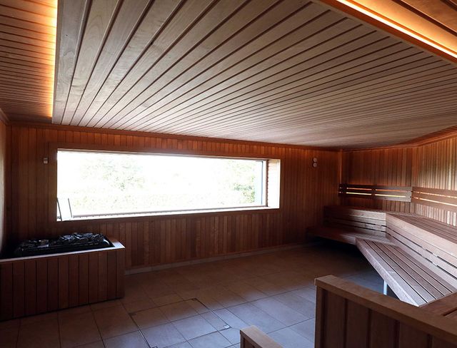 Timber-lined sauna with picture window at the Culloden Estate and Spa