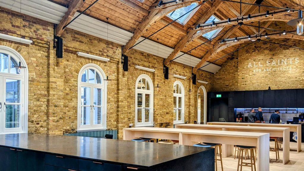 EPR Studios timber-truss hall with kitchen bar