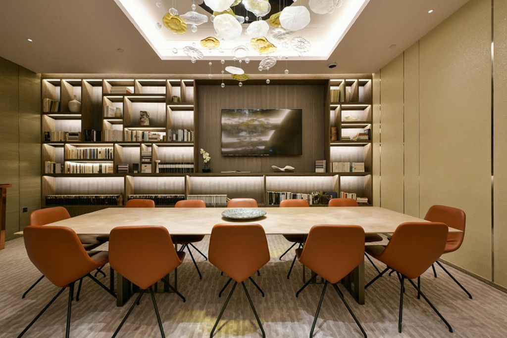 Lillie Square meeting room with backlit library shelving