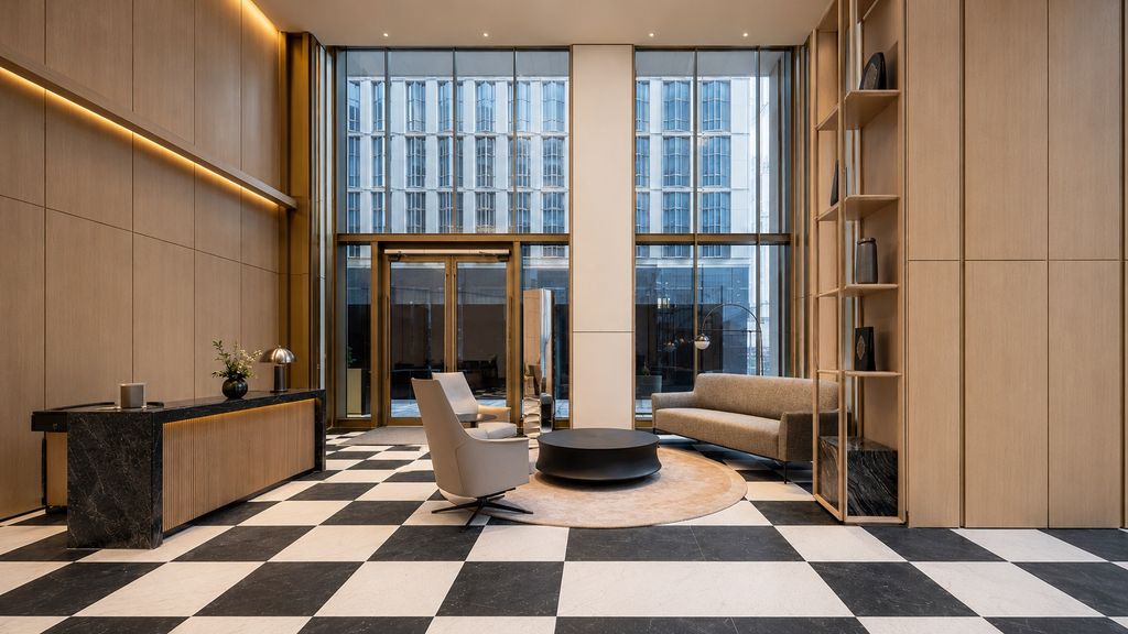 One Nine Elms resident lounge with oak joinery and chequerboard floor